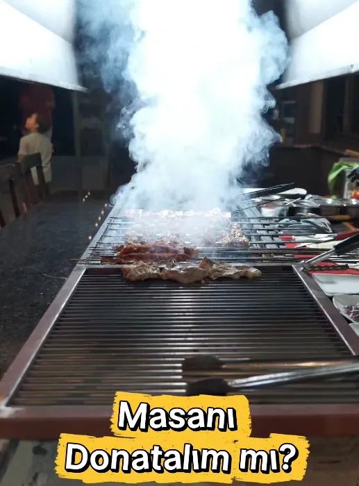 Ocağın üstünde yükselen duman; kömür ateşinde pişen etler